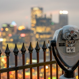 A tower viewer from Mount Washington, unveiling the Pittsburgh skyline in the evening.
