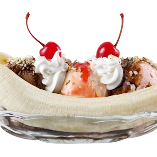 Close-up of a banana split on a white background